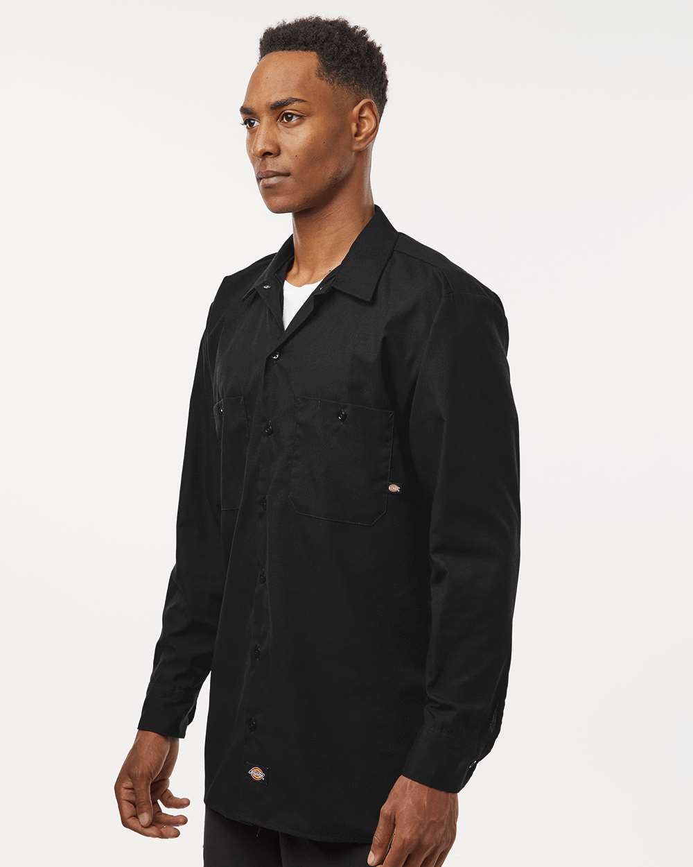 Man wearing a black button-up shirt on a white background. Dickie's Men's Industrial long Sleeve Work Shirt, Embroidered by Helmsman Stitch Co.