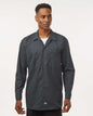 Man wearing a dark gray button-up shirt on a white background. Dickie's Men's Industrial long Sleeve Work Shirt, Embroidered by Helmsman Stitch Co.
