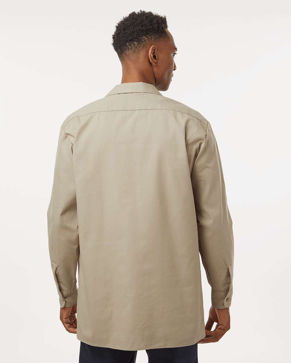 Man wearing a beige trench coat on a white background. Dickie's Men's Industrial long Sleeve Work Shirt, Embroidered by Helmsman Stitch Co.