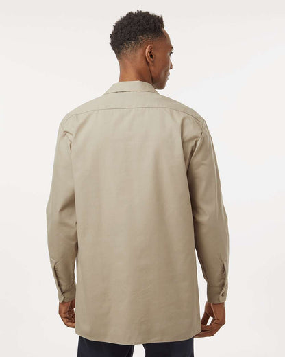 Man wearing a beige trench coat on a white background. Dickie's Men's Industrial long Sleeve Work Shirt, Embroidered by Helmsman Stitch Co.