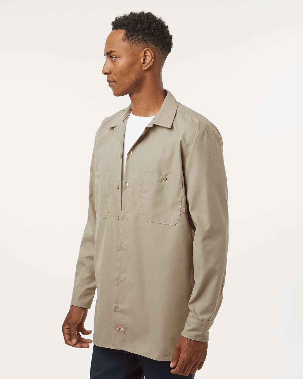 Man wearing a beige jacket on a white background. Dickie's Men's Industrial long Sleeve Work Shirt, Embroidered by Helmsman Stitch Co.