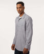 Man wearing a gray button-up shirt on a white background. Dickie's Men's Industrial long Sleeve Work Shirt, Embroidered by Helmsman Stitch Co.