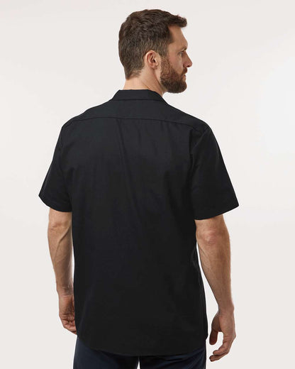 Man wearing a black short-sleeve shirt on a white background. Dickie's Men's Industrial Short Sleeve Work Shirt, Embroidered by Helmsman Stitch Co.