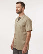 Man wearing a beige short-sleeve shirt on a white background. Dickie's Men's Industrial Short Sleeve Work Shirt, Embroidered by Helmsman Stitch Co.