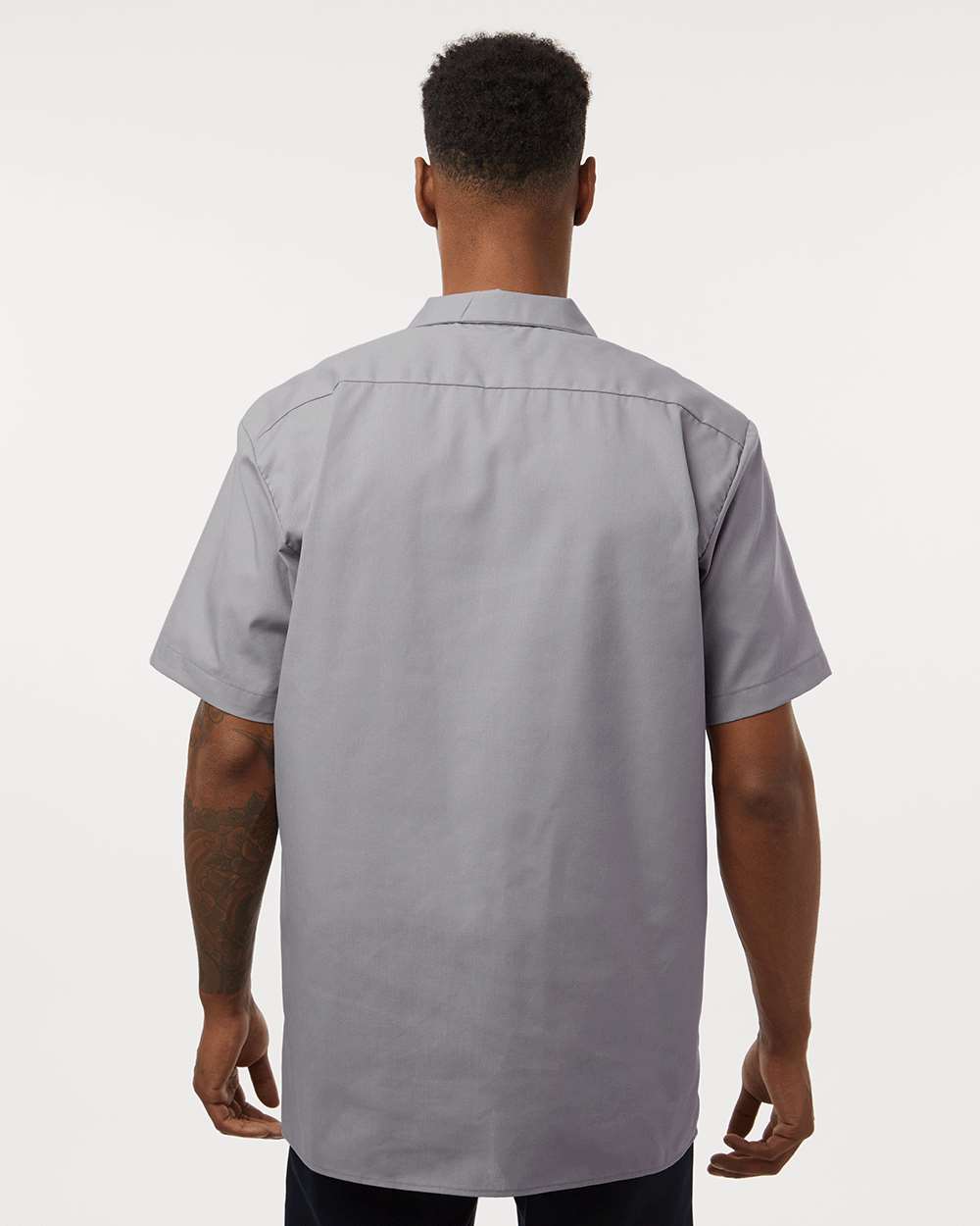 Man wearing a gray short-sleeve shirt on a white background. Dickie's Men's Industrial Short Sleeve Work Shirt, Embroidered by Helmsman Stitch Co.