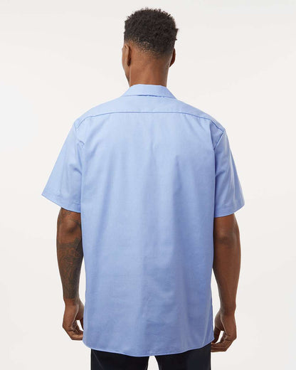 Man wearing a light blue short-sleeve shirt on a white background. Dickie's Men's Industrial Short Sleeve Work Shirt, Embroidered by Helmsman Stitch Co.