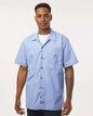 Man wearing a light blue short-sleeve button-up shirt on a white background. Dickie's Men's Industrial Short Sleeve Work Shirt, Embroidered by Helmsman Stitch Co.