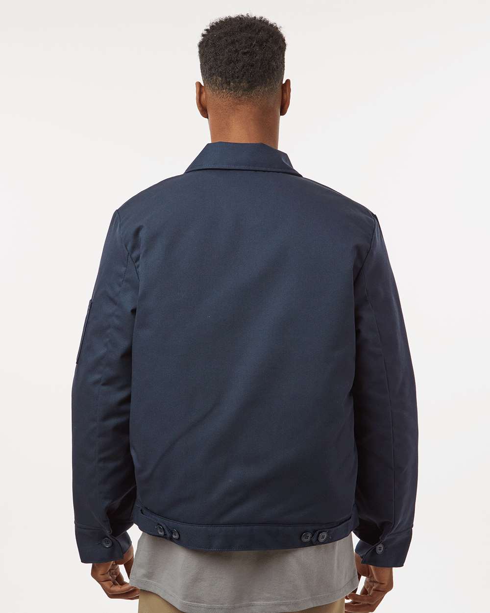 Man wearing a navy blue jacket on a white background. Dickie's Unisex Insulated Industrial Eisenhower Jacket, Embroidered