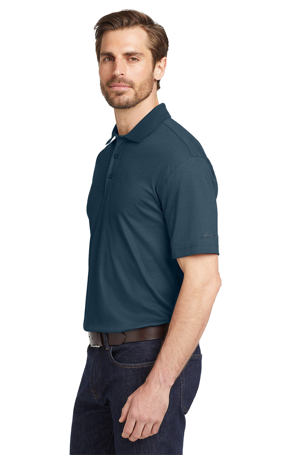Man wearing a navy blue polo shirt on a white background, Eddie Bauer® Performance Polo, Embroidered