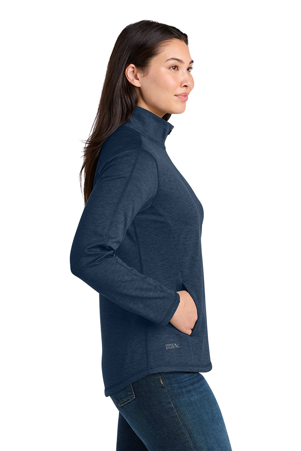 A woman shown in side profile wearing a dark heathered blue long-sleeve quarter-zip athletic top and blue jeans against a plain white background. Eddie Bauer® Women’s Adventurer Full-Zip, Embroidered