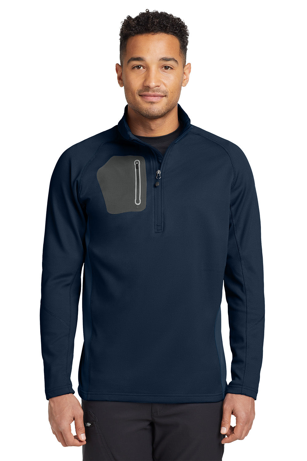 Man wearing a navy long-sleeve shirt with a gray pocket on a white. Eddie Bauer® 1/2-Zip Performance Fleece, Embroideredbackground