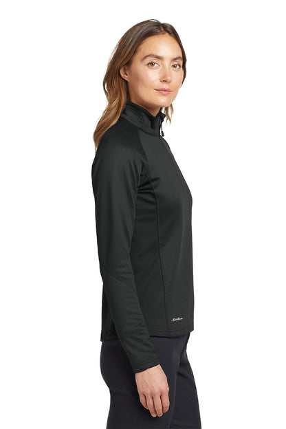 Woman wearing a black jacket on a white background. Eddie Bauer® Women's 1/2-Zip Performance Fleece, Embroidered