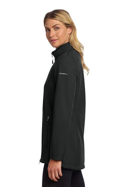 Woman wearing a black jacket with a brand logo on a white background embroidered Eddie Bauer® Women's Stretch Soft Shell Jacket