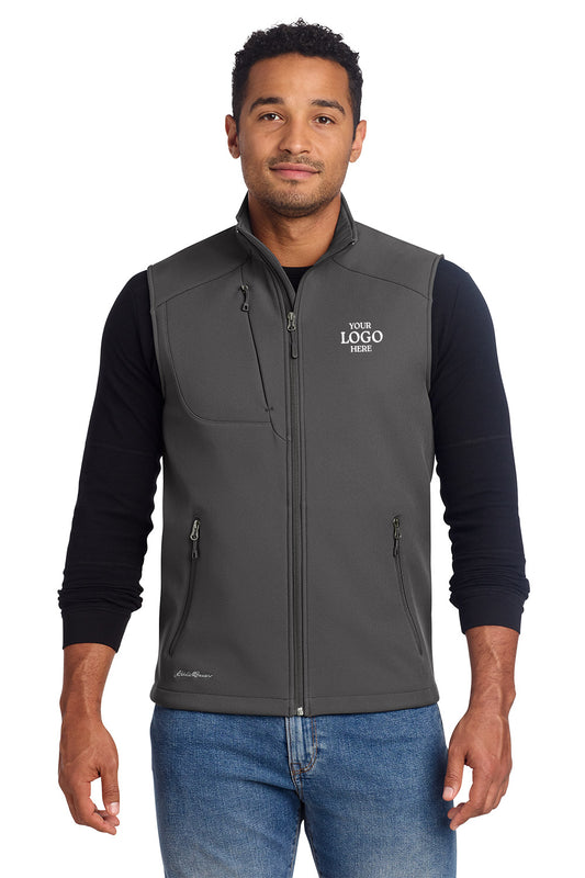 Man wearing a gray vest with a logo on a white background embroidered Eddie Bauer® Stretch Soft Shell Vest