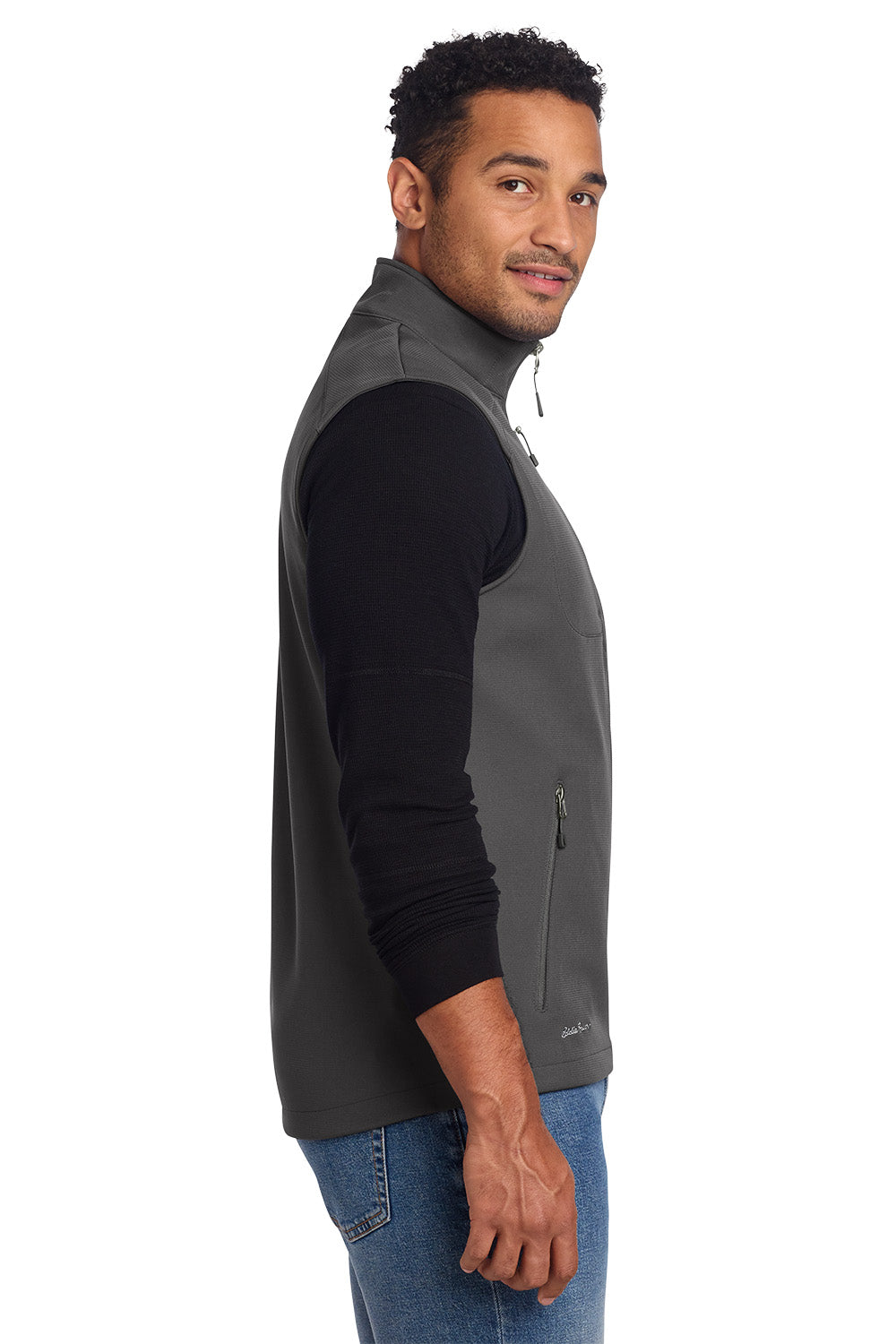 Man wearing a gray vest over a black shirt on a white background embroidered Eddie Bauer® Stretch Soft Shell Vest