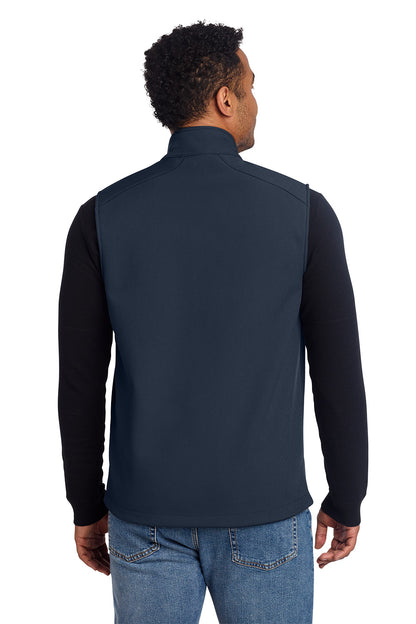 Man wearing a navy vest over a black long-sleeve shirt on a white background, embroidered Eddie Bauer® Stretch Soft Shell Vest