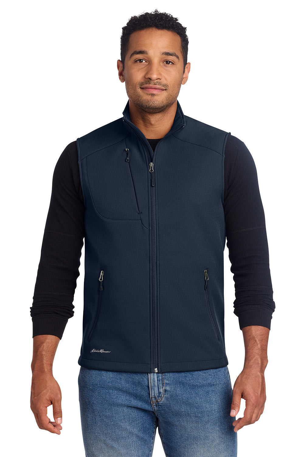 Man wearing a navy vest over a black long-sleeve shirt with a white background, embroidered Eddie Bauer® Stretch Soft Shell Vest