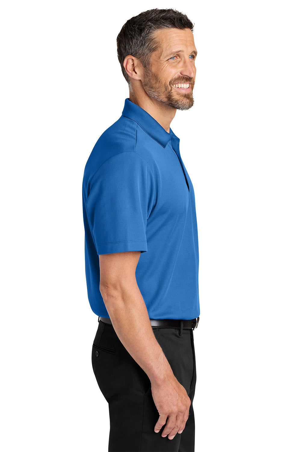 Man wearing a blue polo shirt on a white background. Port Authority® Plaited Pique Polo, Embroidered by Helmsman Stitch Co.