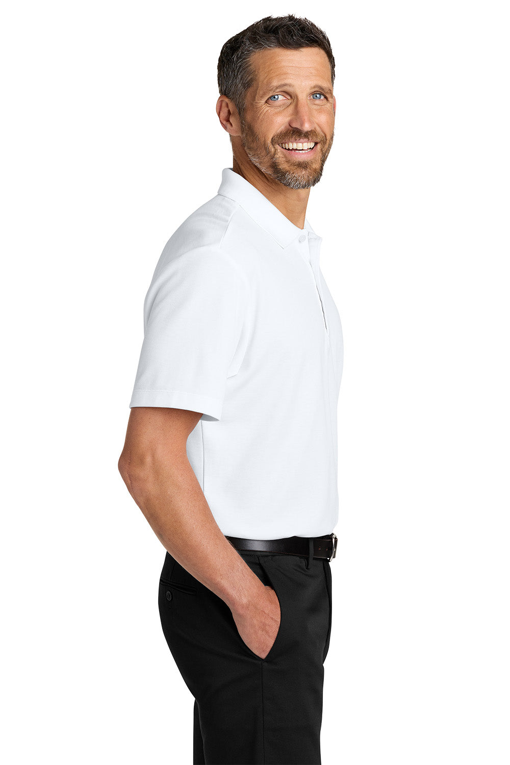 Man wearing a white polo shirt and black pants on a white background. Port Authority® Plaited Pique Polo, Embroidered by Helmsman Stitch Co.