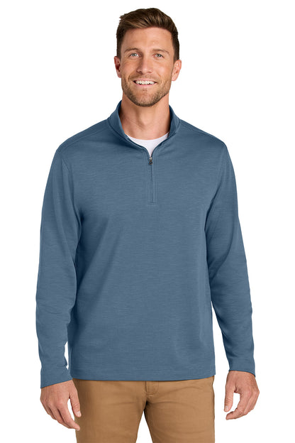 A man wearing a slate blue quarter-zip long-sleeve shirt over a white undershirt and tan pants, standing against a solid white background. Port Authority® Breakwater 1/4-Zip Pullover, Embroidered