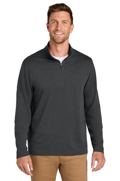 A man wearing a dark charcoal gray quarter-zip long-sleeve shirt over a white undershirt, paired with tan pants, against a solid white background. Port Authority® Breakwater 1/4-Zip Pullover, Embroidered