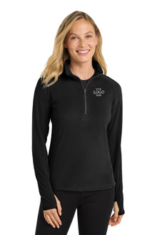 Woman wearing a black pullover with a logo on a white background Port Authority® Women's Microfleece 1/2-Zip Pullover, Embroidered