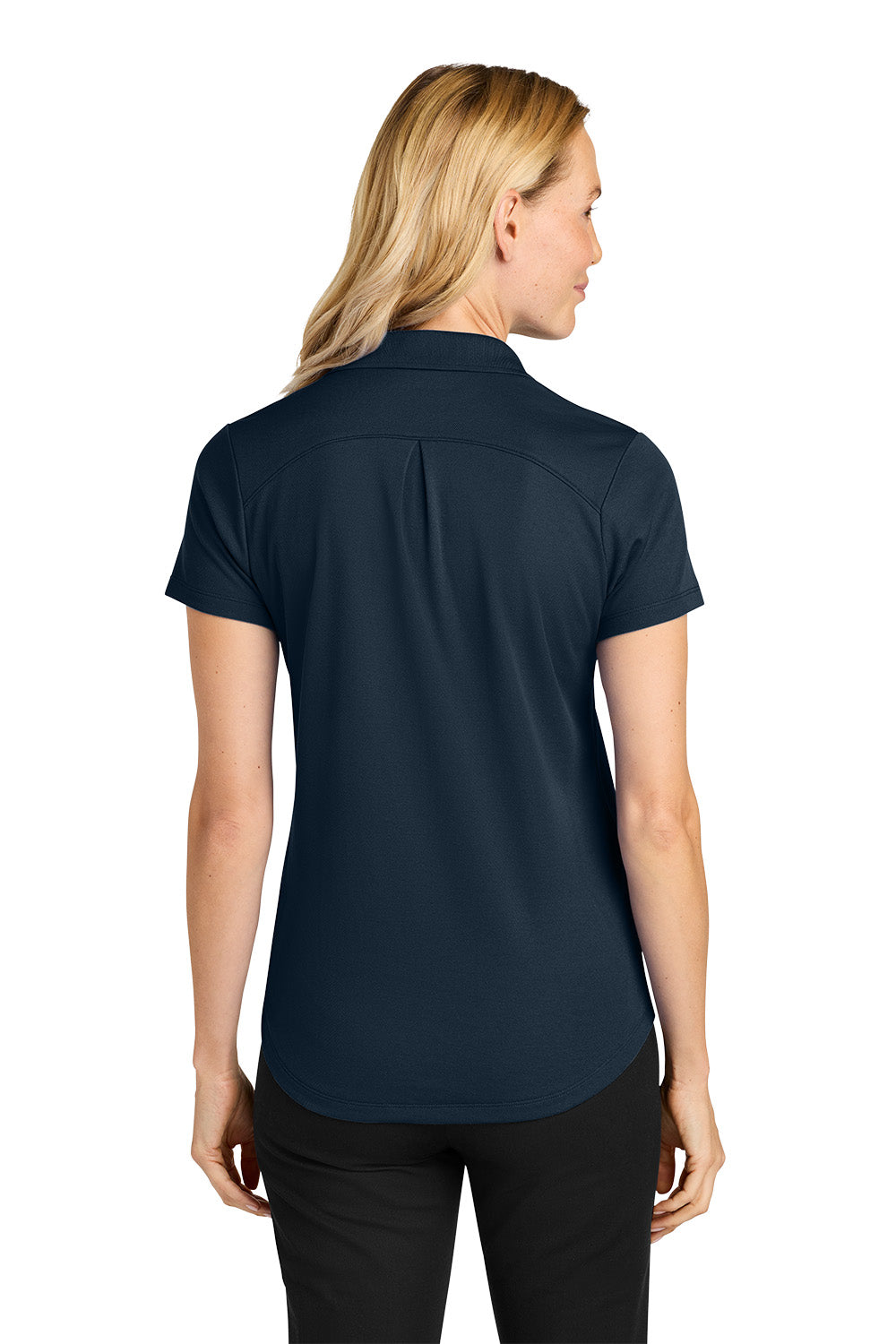 Woman wearing a navy blue polo shirt on a white background. Port Authority® Women’s Plaited Pique Polo, Embroidered by Helmsman Stitch Co.