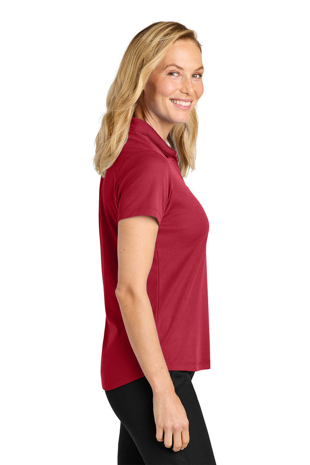 Woman wearing a red polo shirt on a white background. Port Authority® Women’s Plaited Pique Polo, Embroidered by Helmsman Stitch Co.