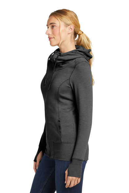 Woman wearing a dark gray hoodie on a white background, embroidered New Era® Woman's Tri-Blend Fleece Full-Zip Hoodie