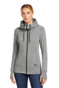 Woman wearing a gray hoodie with a brand logo on a white background, embroidered New Era® Woman's Tri-Blend Fleece Full-Zip Hoodie