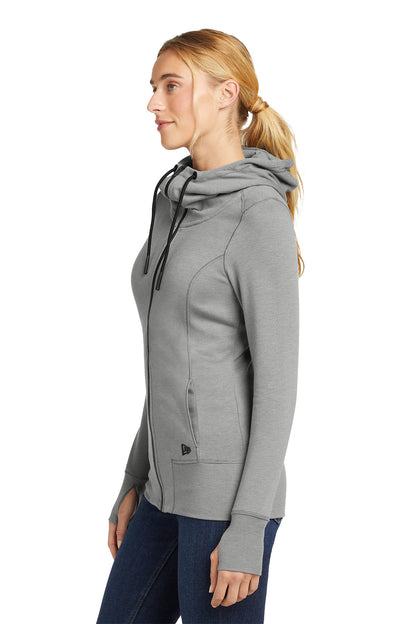Woman wearing a gray hoodie on a white background, embroidered New Era® Woman's Tri-Blend Fleece Full-Zip Hoodie