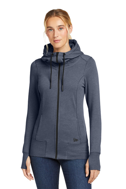Woman wearing a blue hooded jacket on a white background, embroidered New Era® Woman's Tri-Blend Fleece Full-Zip Hoodie
