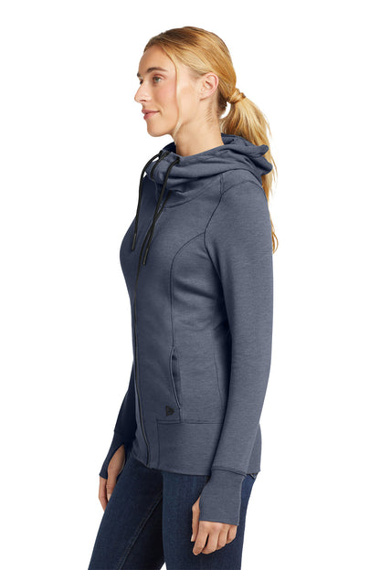 Woman wearing a gray hoodie on a white background, embroidered New Era® Woman's Tri-Blend Fleece Full-Zip Hoodie
