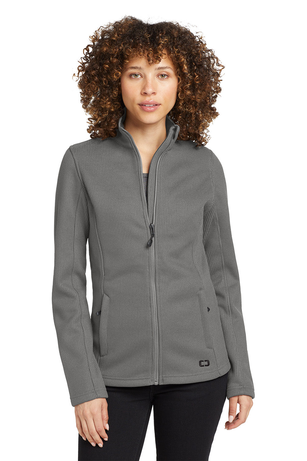 Woman wearing a gray jacket on a white background Embroidered OGIO® Women's Grit Fleece Jacket