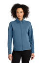 Woman wearing a blue jacket on a white background OGIO® Women’s Transcend Full-Zip, Embroidered