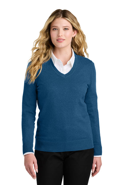 Woman wearing a blue sweater over a white shirt on a white background. Port Authority® Women’s Easy Care V-Neck Sweater, Embroidered