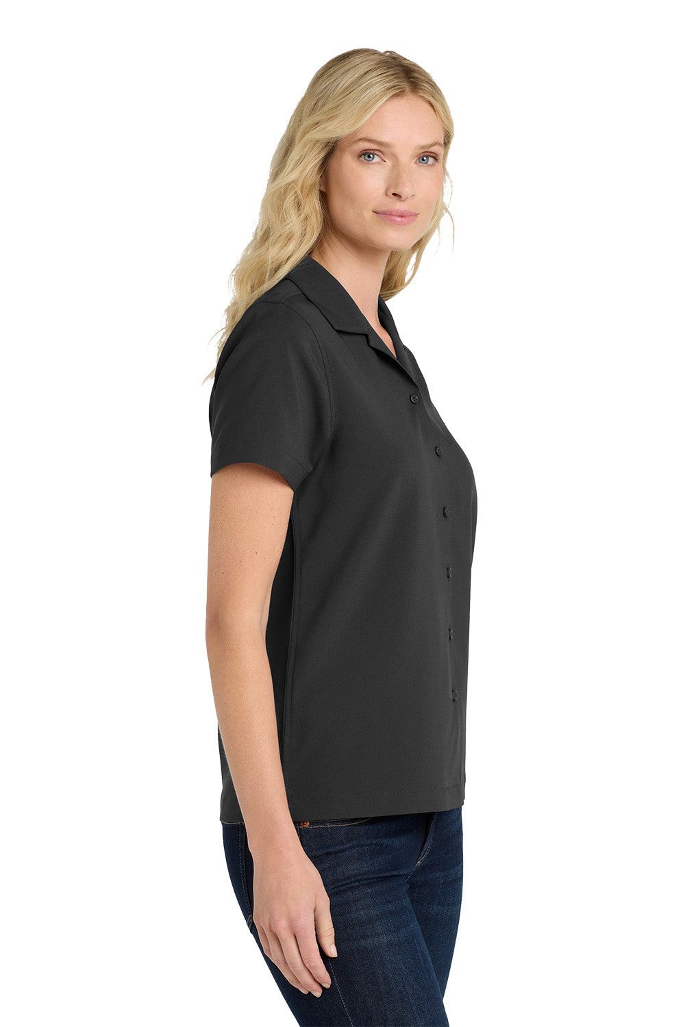 Woman wearing a black polo shirt on a white background embroidered Port Authority® Women's Short Sleeve Performance Staff Shirt