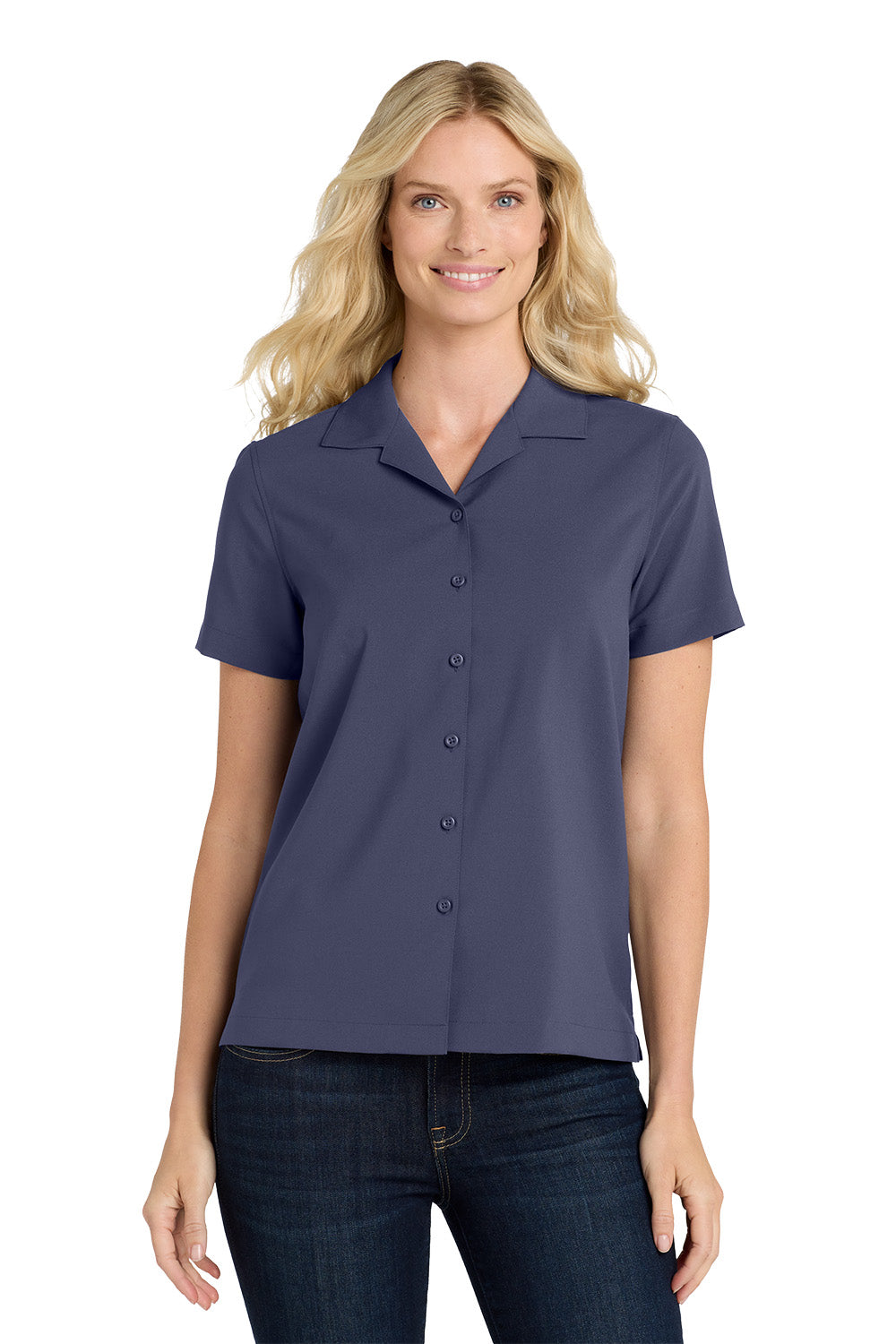 Woman wearing a navy blue short-sleeve blouse with buttons on a white background embroidered Port Authority® Women's Short Sleeve Performance Staff Shirt