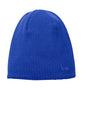 Blue knit beanie with a logo on a white background embroidered New Era® Knit Beanie