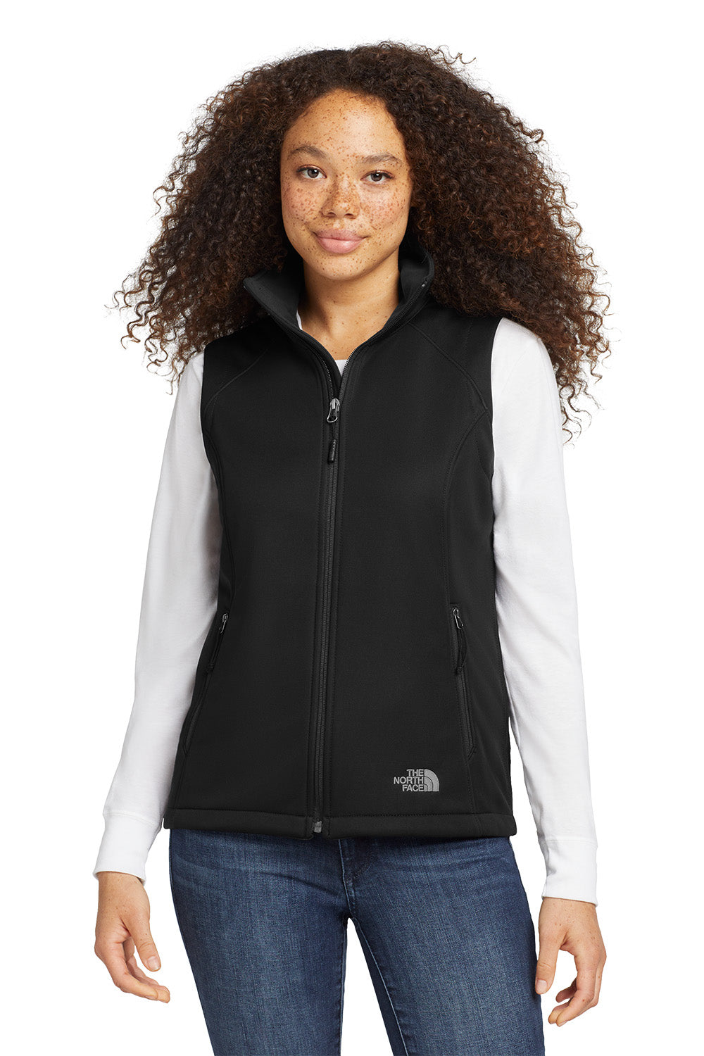 Woman wearing a black vest over a white shirt with a visible brand logo on a white background embroidered The North Face® Women's Ridgewall Soft Shell Vest