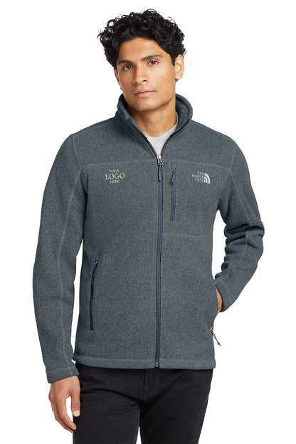 Man wearing a gray fleece jacket with a logo on a white background embroidered The North Face® Sweater Fleece Jacket