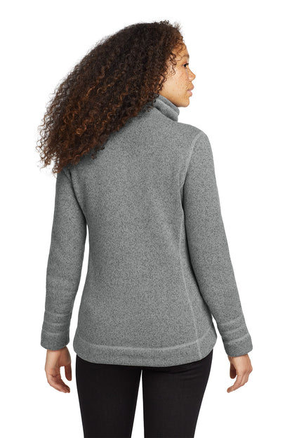 Person wearing a gray fleece jacket on a white background embroidered The North Face® Women's Sweater Fleece Jacket