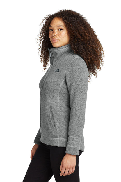 Woman wearing a gray fleece jacket on a white background embroidered The North Face® Women's Sweater Fleece Jacket