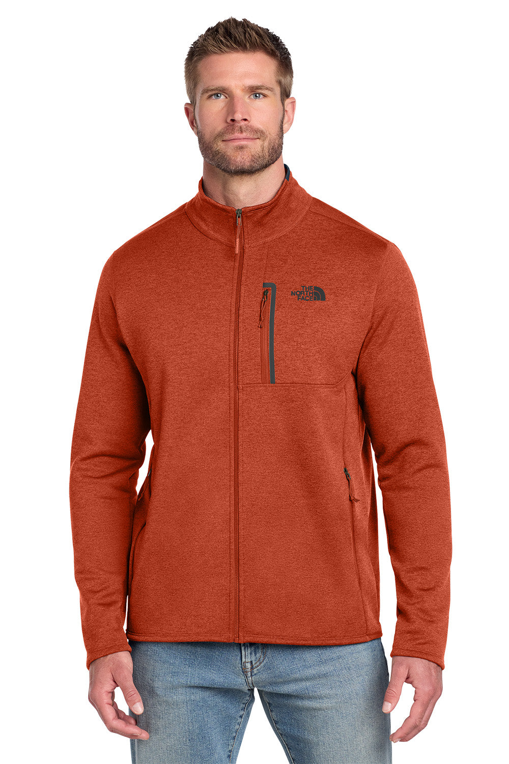 Man wearing an orange jacket with a brand logo on a white background embroidered The North Face® Skyline Full-Zip Fleece Jacket