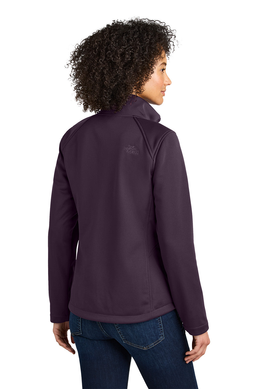 Person wearing a purple jacket with a brand logo on a white background embroidered The North Face® Women's Chest Logo Ridgewall Soft Shell Jacket