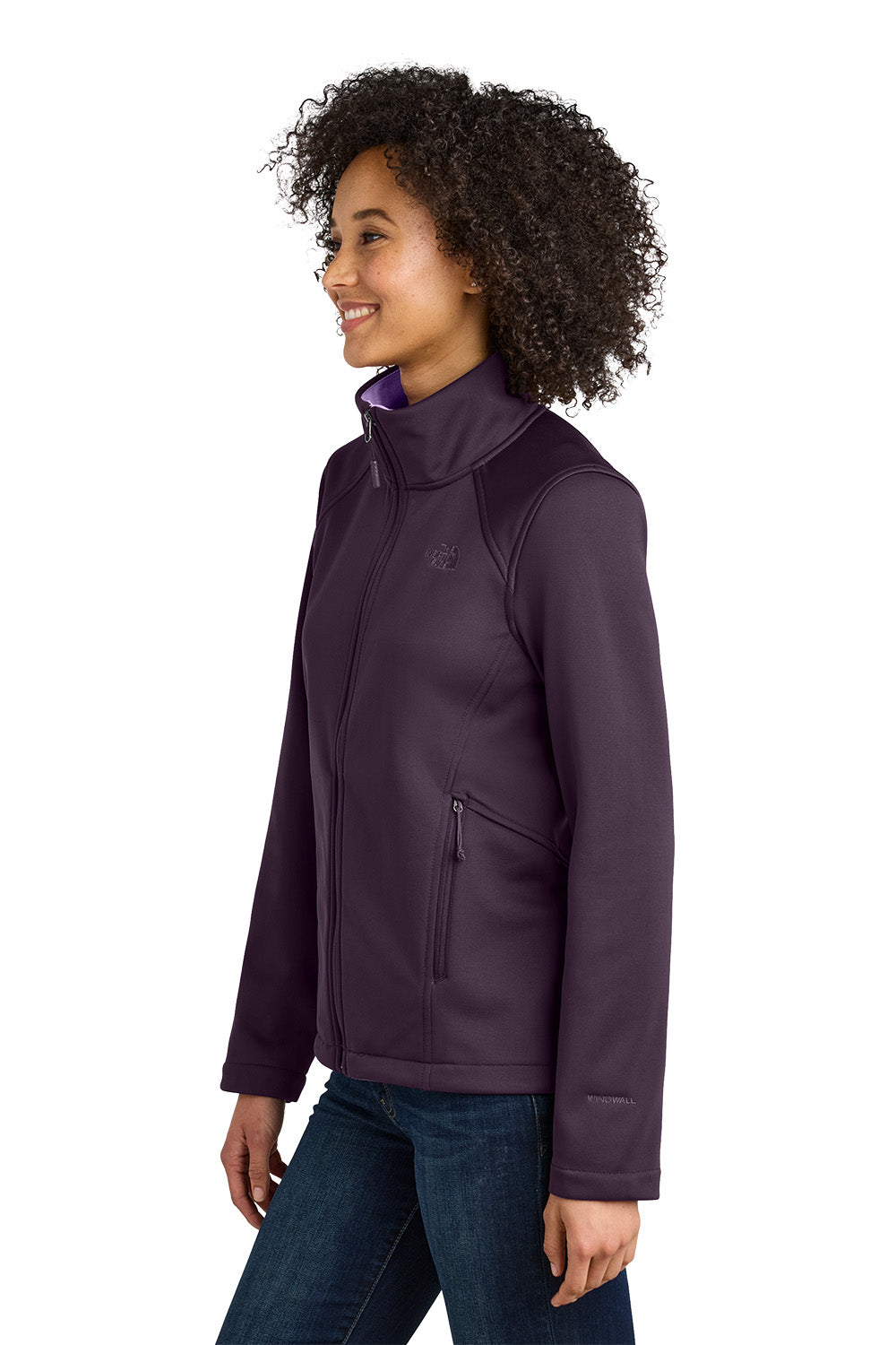 Woman wearing a purple jacket on a white background embroidered The North Face® Women's Chest Logo Ridgewall Soft Shell Jacket