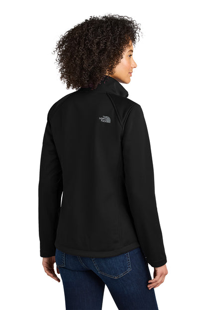 Person wearing a black jacket with a brand logo on the back, standing against a white background embroidered The North Face® Women's Chest Logo Ridgewall Soft Shell Jacket
