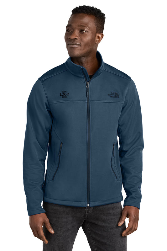 Man wearing a blue jacket with logos on a white background embroidered The North Face® Chest Logo Ridgewall Soft Shell Jacket
