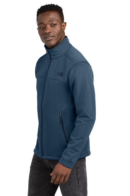 Man wearing a blue jacket on a white background embroidered The North Face® Chest Logo Ridgewall Soft Shell Jacket
