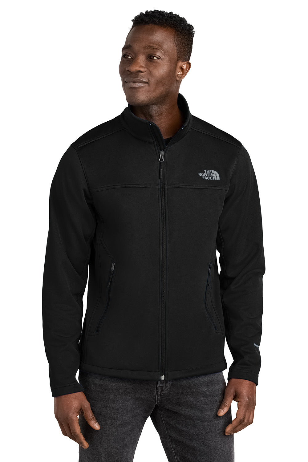 Man wearing a black jacket with The North Face logo on a white background embroidered The North Face® Chest Logo Ridgewall Soft Shell Jacket